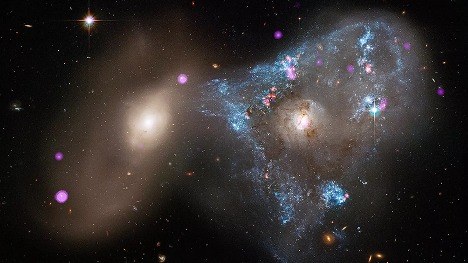 Sudar galaksija zabeležen instrumentima NASA Chandra. Tematska ilustracija uz vest o Chandra teleskopu.