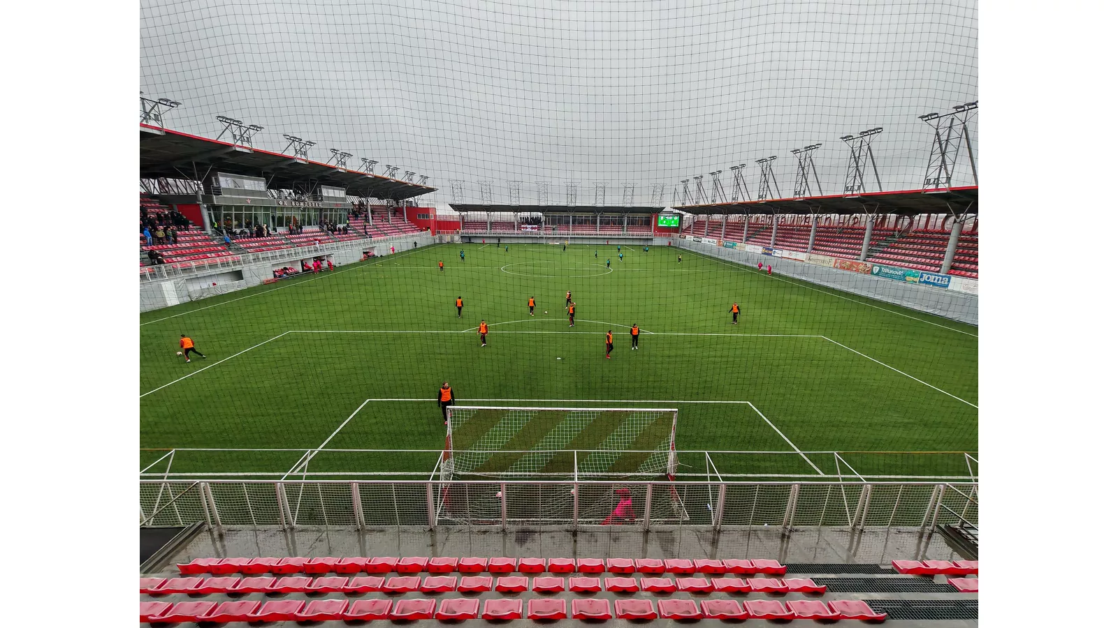 View on the football pitch of Voždovac Stadium from the south stand.jpg. View on the football pitch of Voždovac Stadium from the south stand, February 2026. Ilustracija uz vest: Arsenal i Liverpool prate Kevina Schadea, navode transfer izveštaji